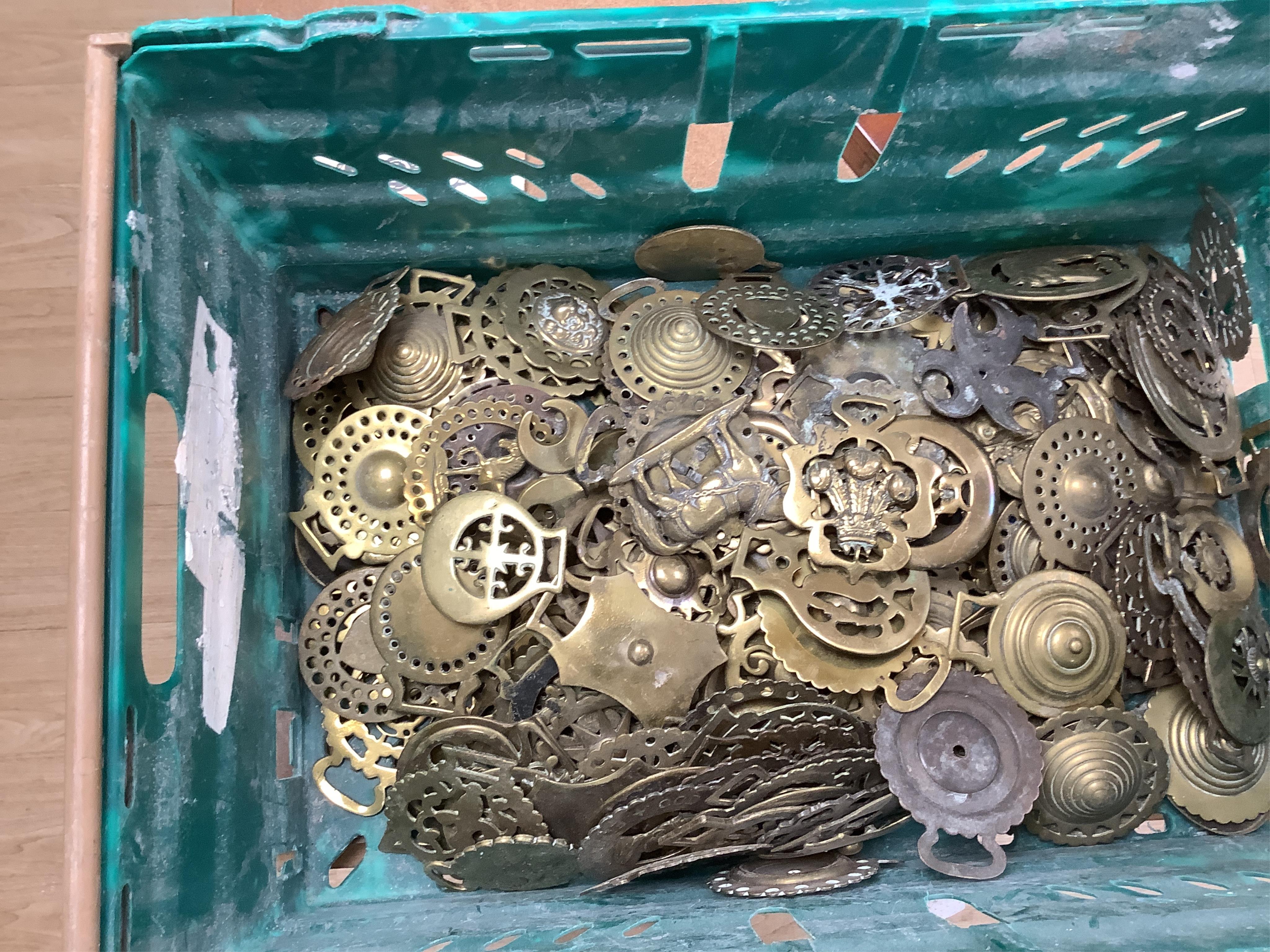 A collection of various horse brasses